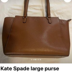 Like new Kate spade purse. Cognac color and no signs of wear.